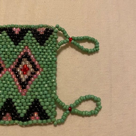 Handmade Huichol-style seed bead bracelet featuring green, black, pink & red. - Picture 4 of 6